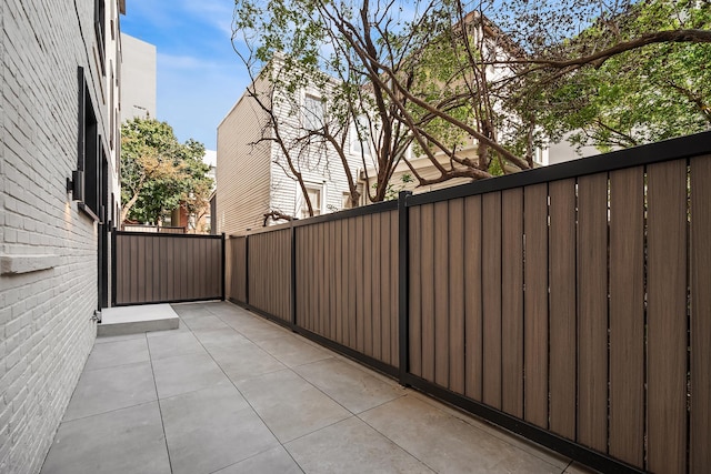 view of patio / terrace featuring fence