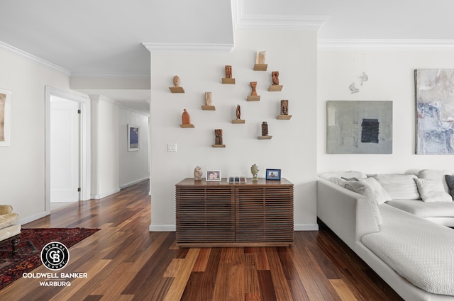 living area with baseboards, wood finished floors, and crown molding