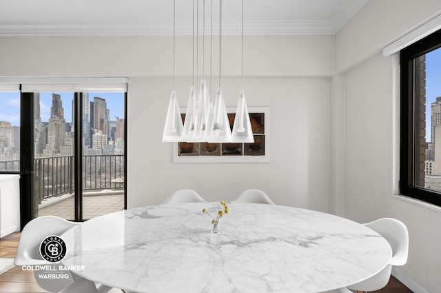 10 W 66th St Unit 27F, New York City, NY 10023 - dining space featuring a skyline view, crown molding, and wood finished floors