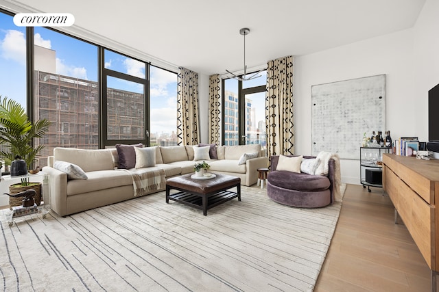 living area featuring expansive windows and light wood-style flooring