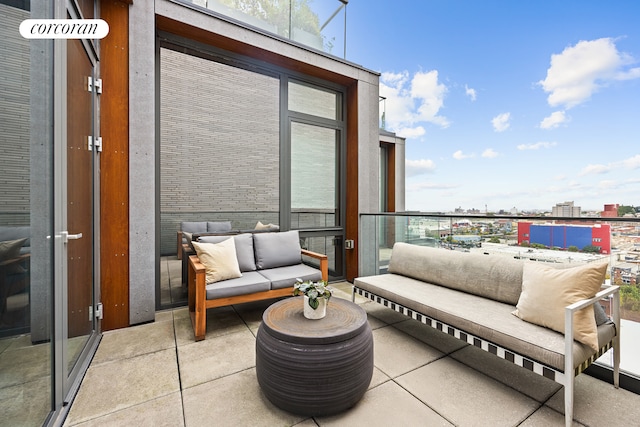 balcony featuring a view of city and an outdoor hangout area