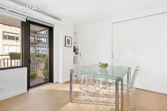 dining space featuring wood finished floors