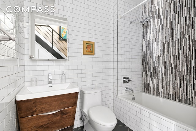172 Wilson Ave Pha, Pha, New York City, NY 11237 - full bath featuring tile walls, vanity, toilet, and tiled shower / bath combo