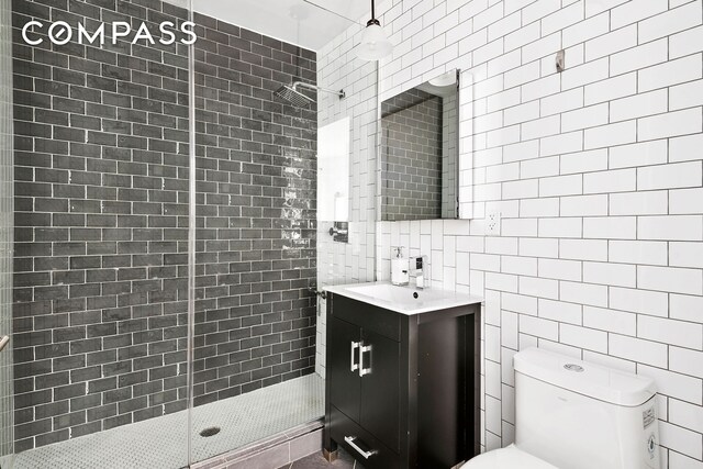 172 Wilson Ave Pha, Pha, New York City, NY 11237 - full bathroom featuring tile walls, a stall shower, and vanity