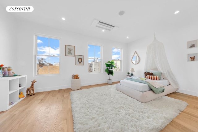 bedroom with recessed lighting, visible vents, baseboards, and light wood-style flooring