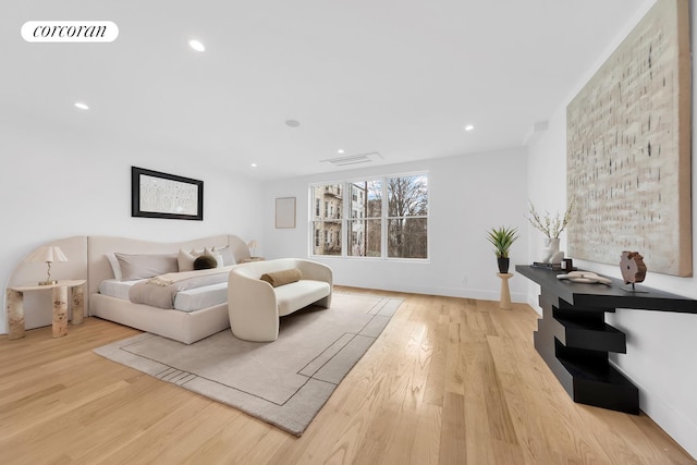 bedroom with visible vents, recessed lighting, and wood finished floors