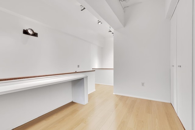 walk in closet featuring light wood finished floors