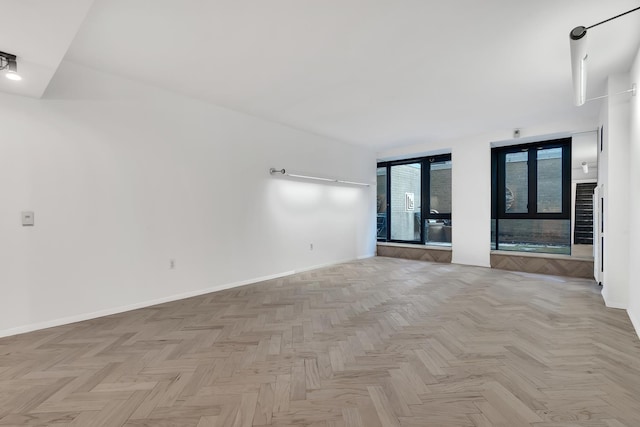 empty room featuring baseboards