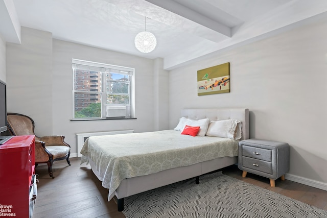 bedroom featuring baseboards and hardwood / wood-style floors