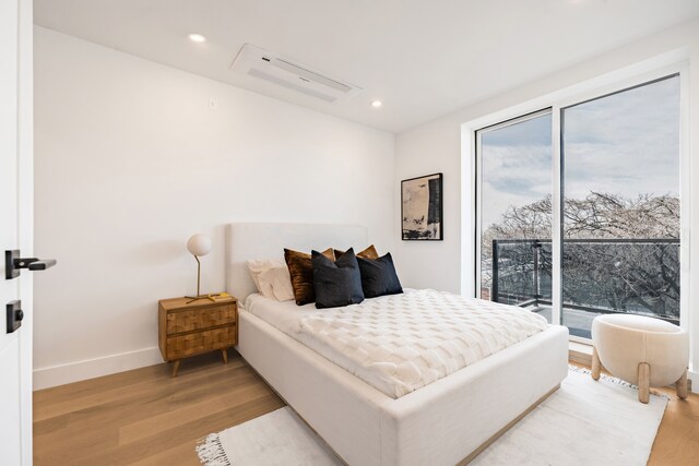 87A Cooper St Ph, Ph, New York City, NY 11207 - bedroom with light wood-style flooring, access to exterior, baseboards, and recessed lighting