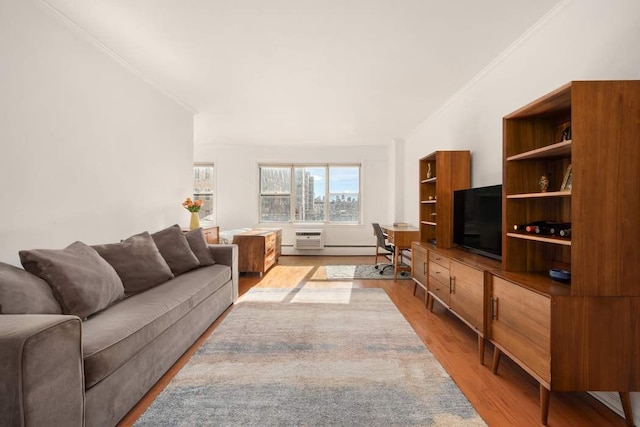 living area with light wood finished floors, crown molding, and a wall unit AC