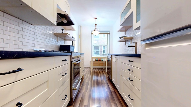 kitchen with open shelves, dark countertops, and white cabinets