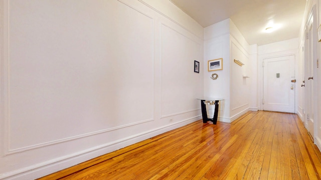 corridor with light wood-style floors