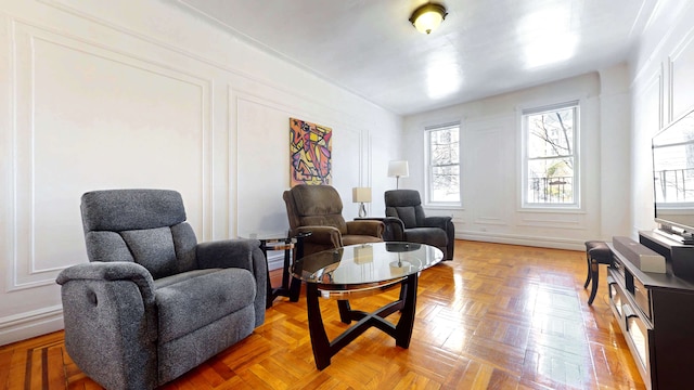 living area with a decorative wall