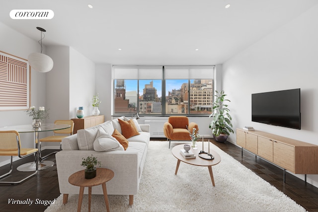 living area featuring recessed lighting, visible vents, and baseboards