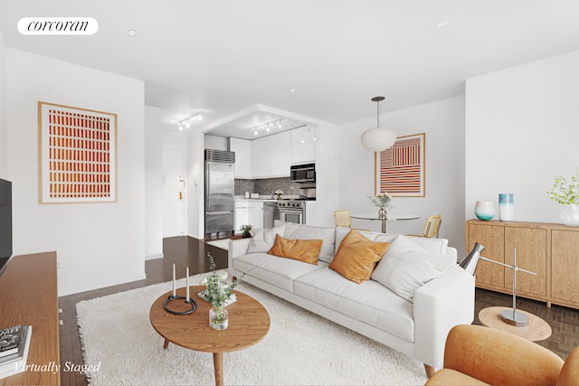 living area with wood finished floors and visible vents