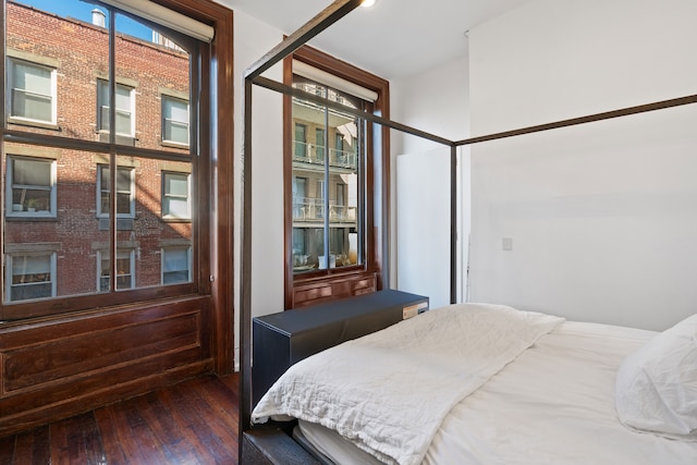 bedroom featuring dark wood-style flooring