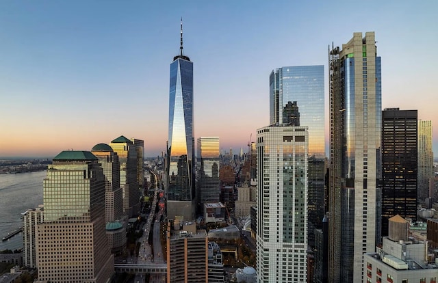 property's view of city featuring a water view