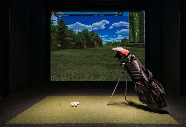 recreation room with golf simulator