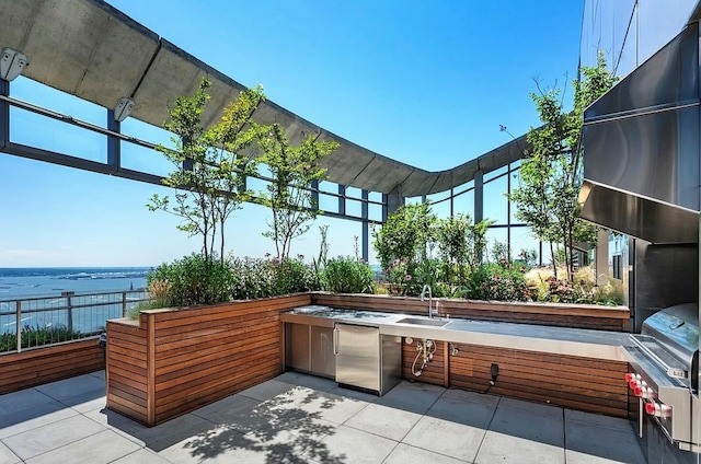 view of patio featuring a sink and area for grilling