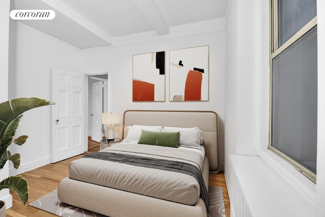 71 Park Ave Unit 3C, New York City, NY 10016 - bedroom with beamed ceiling and wood finished floors
