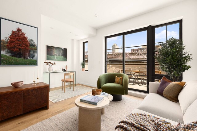 sitting room featuring baseboards and wood finished floors