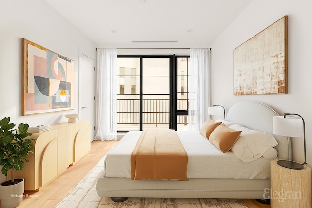 bedroom with access to outside and light wood finished floors