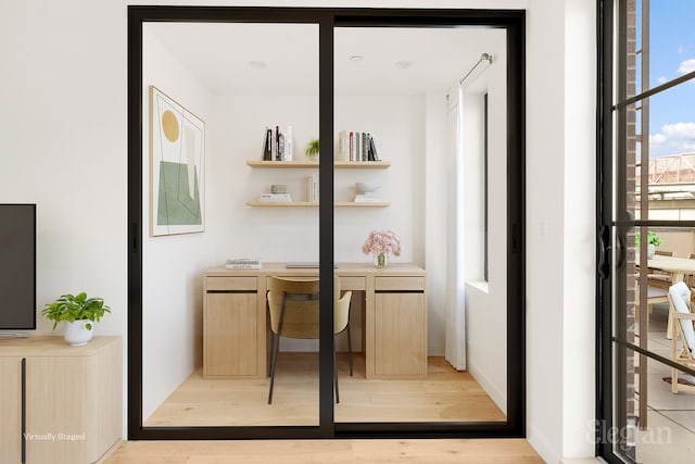 office area with light wood finished floors