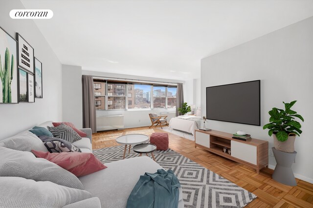 living area featuring visible vents and baseboards