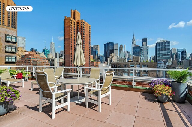 view of patio / terrace featuring a city view