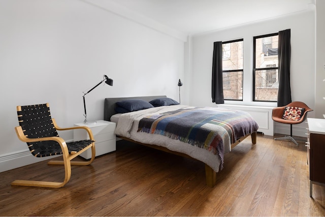 bedroom featuring wood finished floors