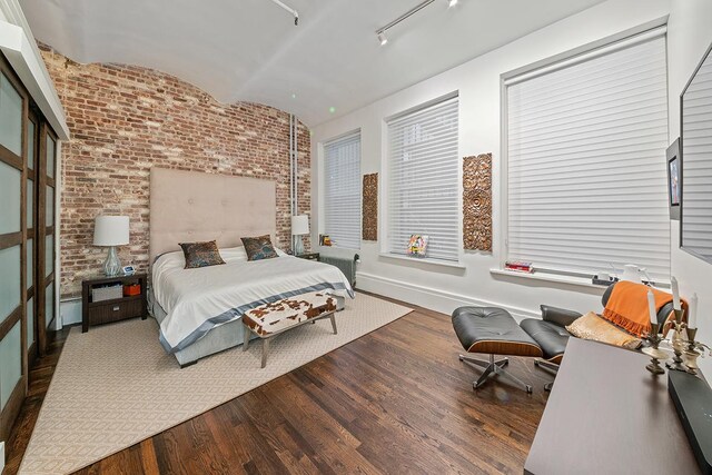 11 W 20th St Unit 4-Flr, New York City, NY 10011 - bedroom with wood finished floors and brick wall