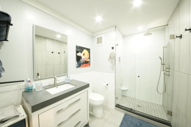 full bath featuring tile patterned flooring, a shower stall, toilet, and vanity