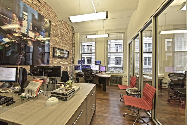 office space featuring dark wood-type flooring and radiator heating unit