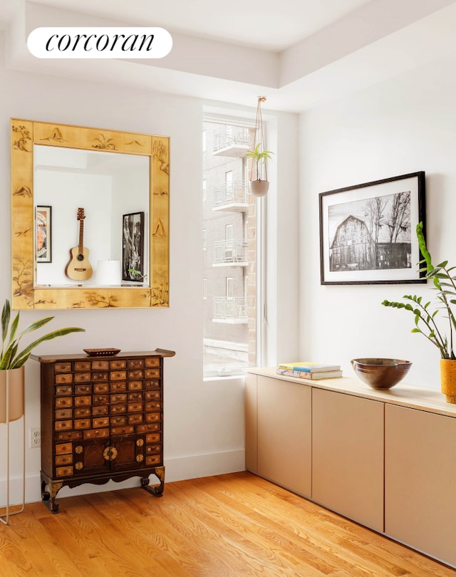 interior space featuring wood finished floors and baseboards