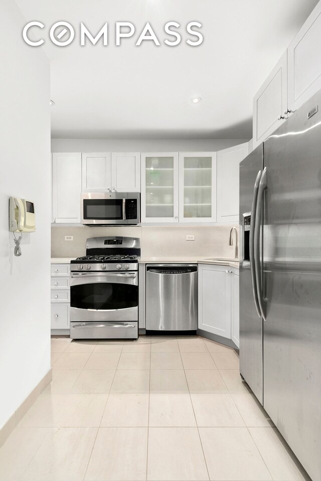 505 Court St Unit 3D, New York City, NY 11231 - kitchen with appliances with stainless steel finishes, light countertops, white cabinets, a sink, and recessed lighting