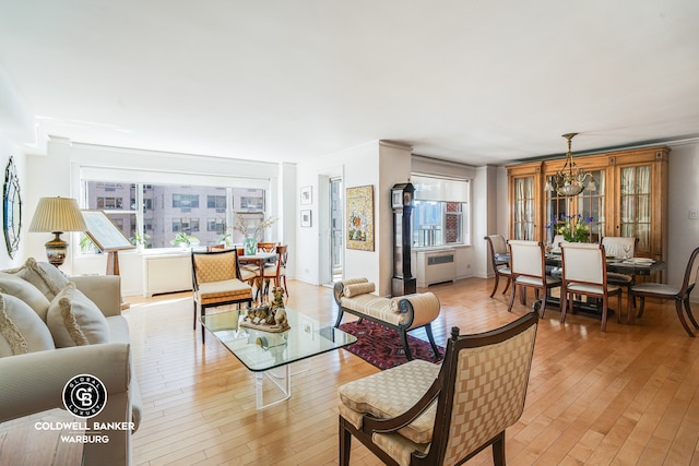 50 Sutton Pl S Unit 14G, New York City, NY 10022 - living room featuring light wood finished floors, a chandelier, and radiator