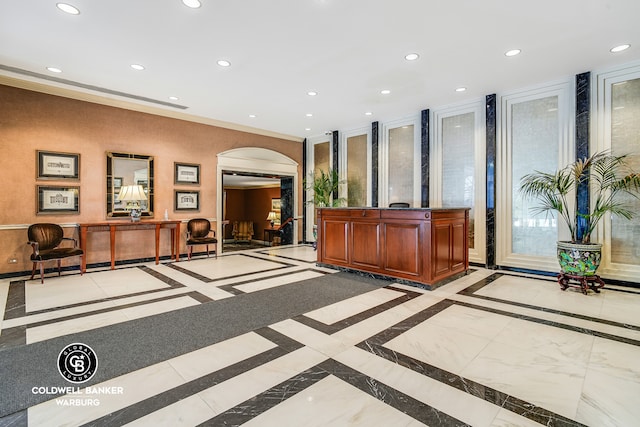 50 Sutton Pl S Unit 14G, New York City, NY 10022 - reception area with arched walkways, recessed lighting, and ornamental molding
