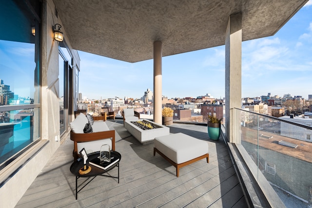 wooden terrace featuring a city view