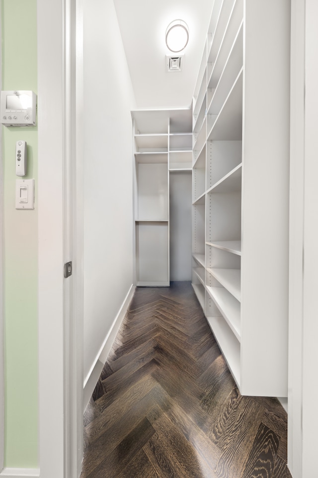 spacious closet featuring visible vents