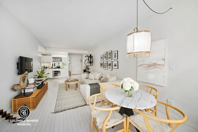 dining area with wood finished floors