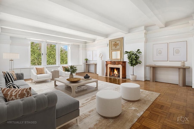 living room with beamed ceiling and a fireplace