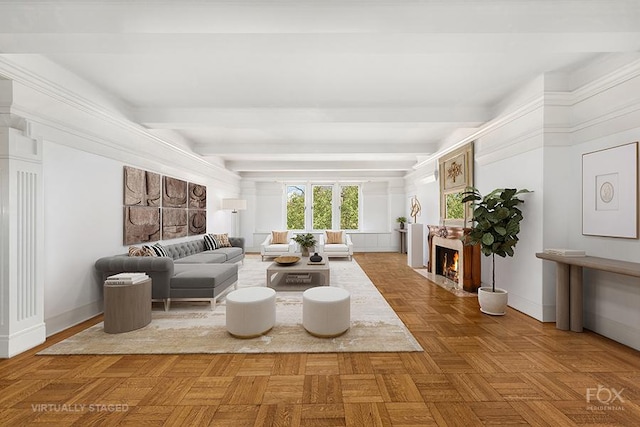 living area featuring a fireplace with flush hearth, beamed ceiling, and baseboards