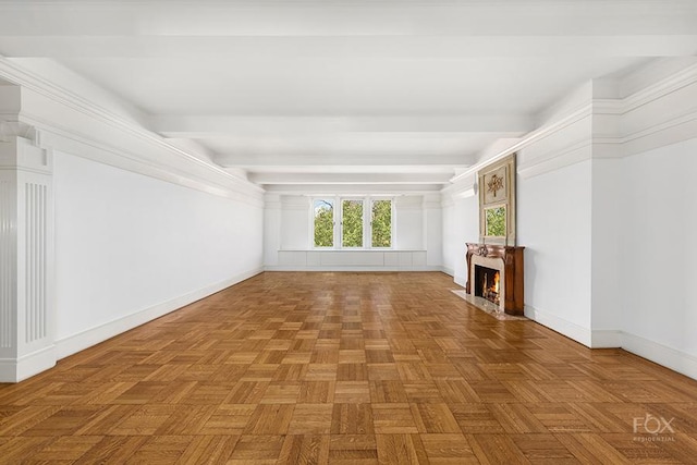 unfurnished living room with a fireplace with flush hearth, baseboards, and beamed ceiling