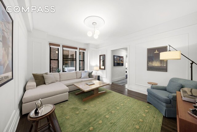 150 E 93rd St Unit 5B, New York City, NY 10128 - living room featuring dark wood-style floors and a chandelier