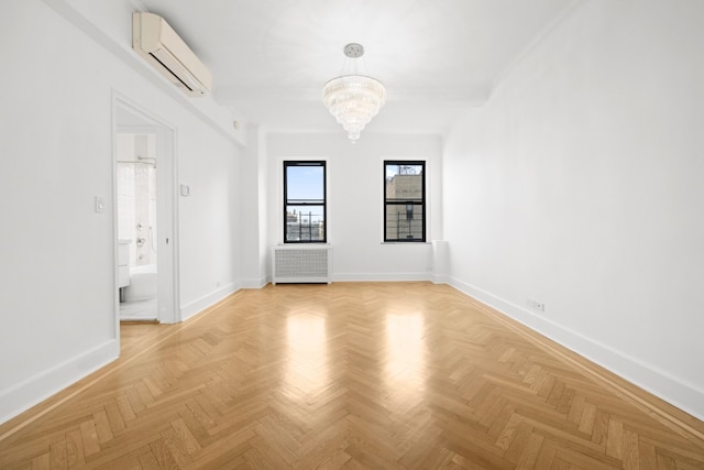 unfurnished room featuring radiator, baseboards, a wall mounted AC, and an inviting chandelier