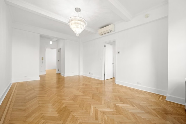 empty room with an AC wall unit, a notable chandelier, baseboards, and beam ceiling