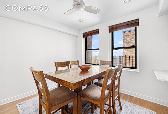 dining space with recessed lighting, ceiling fan, baseboards, and light wood-style floors