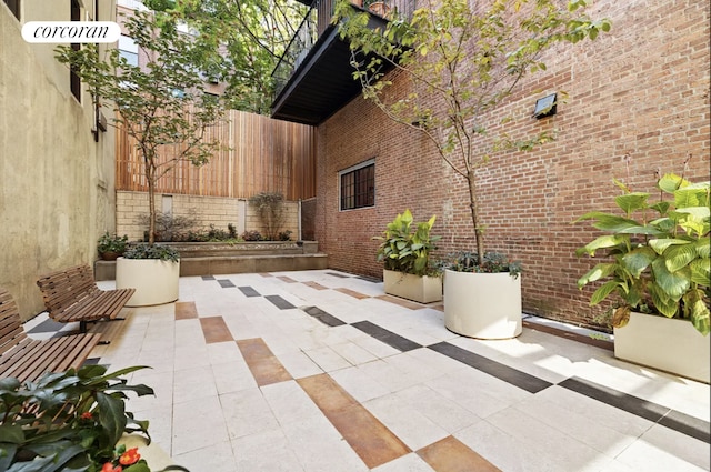 view of patio featuring fence