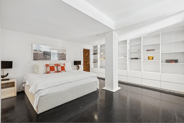 bedroom with recessed lighting and wood finished floors